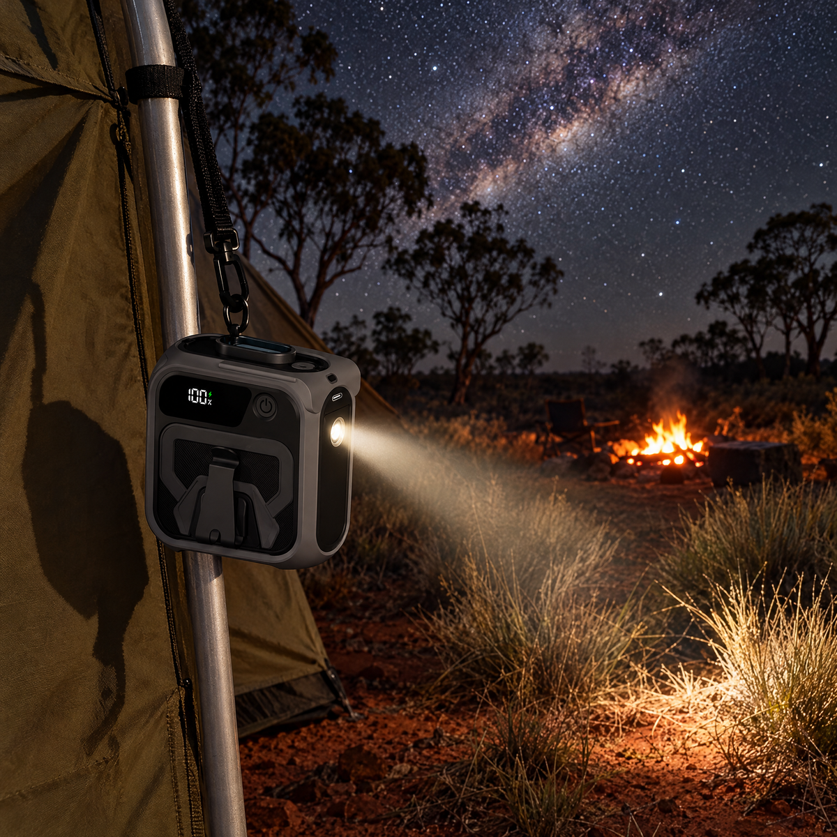 Blow Me Classic hanging from a tent pole at an outback campsite at night with its built-in torch lighting the ground