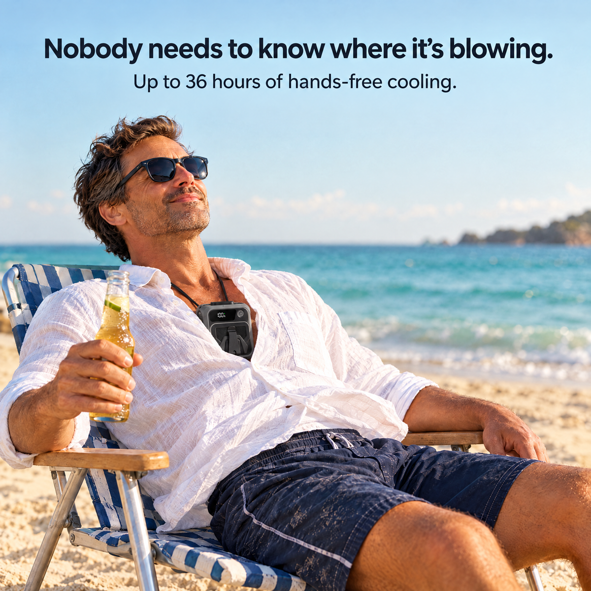 Man relaxing in a beach chair with the Blow Me Classic neck fan tucked inside his linen shirt